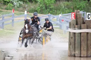 Andy Marcoux and Tara Devine driving Loretta through the water obstacle at Katydid CDE 2026